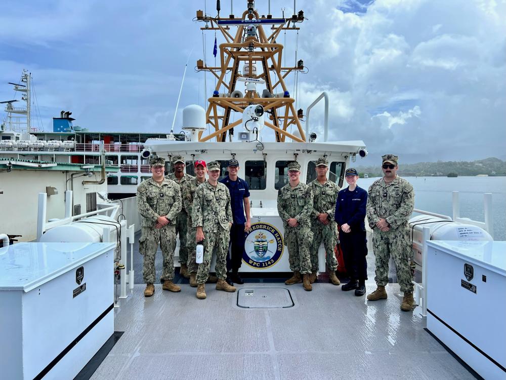 Lt. Patrick Dreiss, commanding officer of the USCGC Frederick Hatch (WPC 1143), and Lt. j.g. Mary Sims, executive officer, stand for a photo as the crew hosts members of the U.S. embassy and the U.S. Navy Seabees aboard the cutter at the pier in Pohnpei, Federated States of Micronesia, on Nov. 22, 2022. 