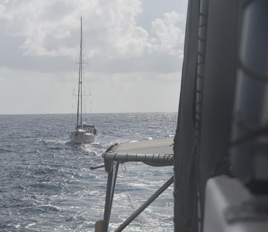 The Coast Guard Cutter Joseph Doyle assists two U.S. boaters while towing the sailing vessel Watoosh Dec. 7, 2022, after the 40-foot sailing vessel was beset by weather in the Caribbean Sea, approximately 150 nautical miles south of Ponce, Puerto Rico. Cutter Joseph Doyle completed the safe tow of the Watoosh to just off the coast Salinas, Puerto Rico, where another vessel took over the tow to bring the vessel to safe harbor Dec. 8, 2022.