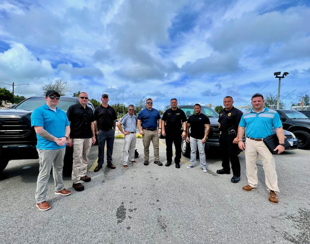 The Port Security and Resiliency Assessment (PSRA) team stand for a photo with members of the Port Authority of Guam and Port Police at Agana Boat Basin on Dec. 7, 2022