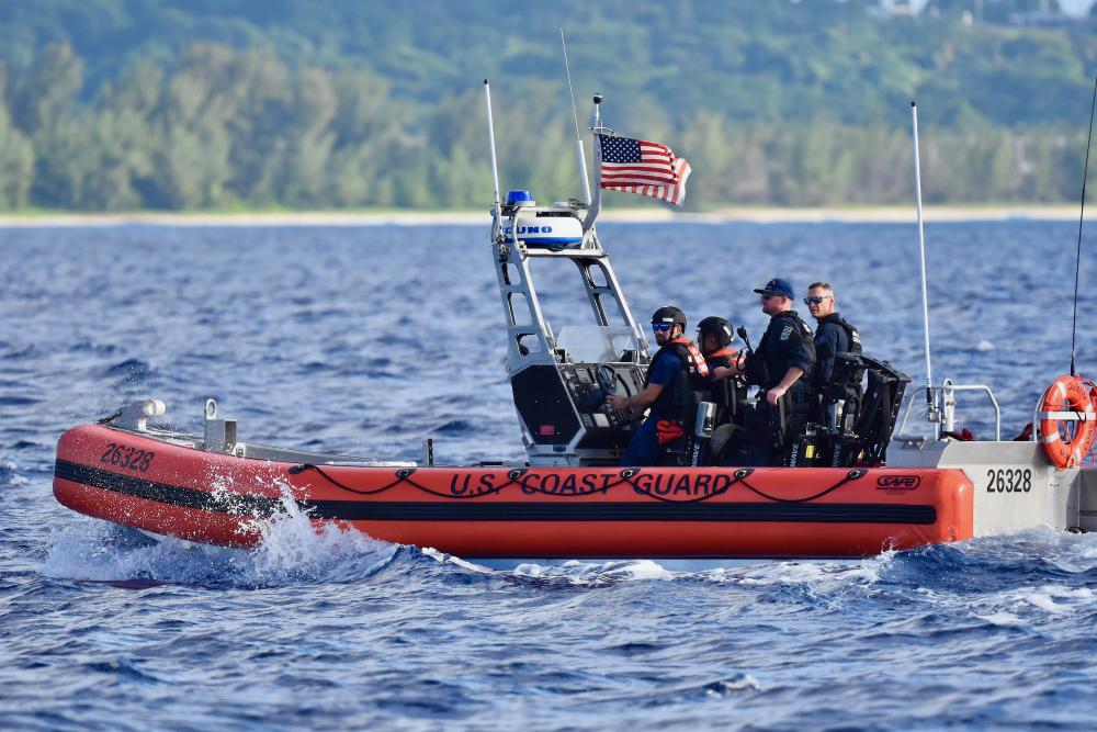 USCGC Oliver Henry (WPC 1140) crew and Maritime Safety and Security Team Honolulu boarding team personnel conduct boating safety operations off Saipan on Dec. 11, 2022.