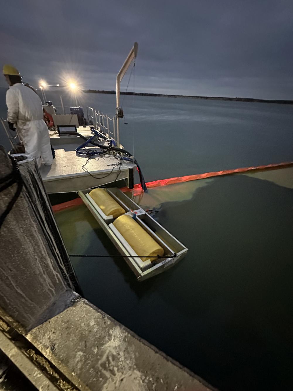 Pollution responders use oil skimmers to collect oil in the La Quinta Channel in Corpus Christi Bay, Texas, Dec. 25, 2022. Coast Guard Sector Corpus Christi personnel estimated up to 3,800 gallons of light crude oil entered the water from a cracked pipeline near the Flint Hills Ingleside facility. (U.S. Coast Guard photo by Petty Officer 2nd Class Stephen McConnell)