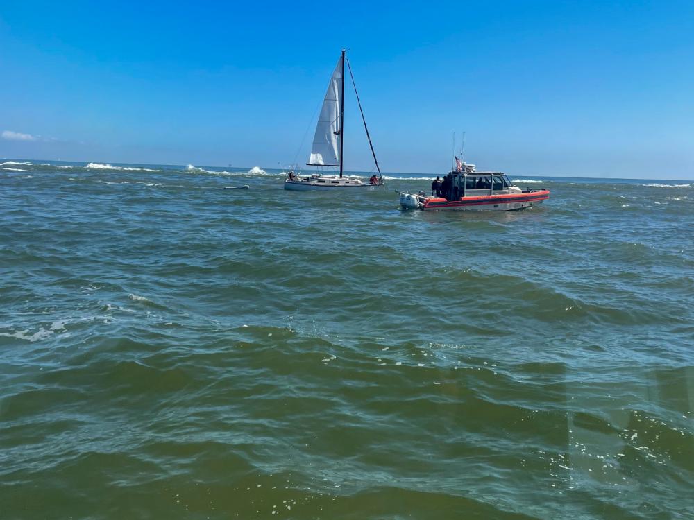 Coast Guard assists two boaters, one dog on aground sailboat 2 miles offshore Fort Morgan, Ala.