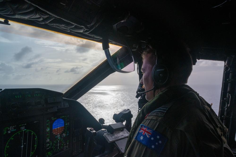 A Royal Australian Air Force C-27J Spartan pilot, assigned to Squadron No. 35, conducts search and rescue operations Feb. 11, 2023, off the coast of Guam. 