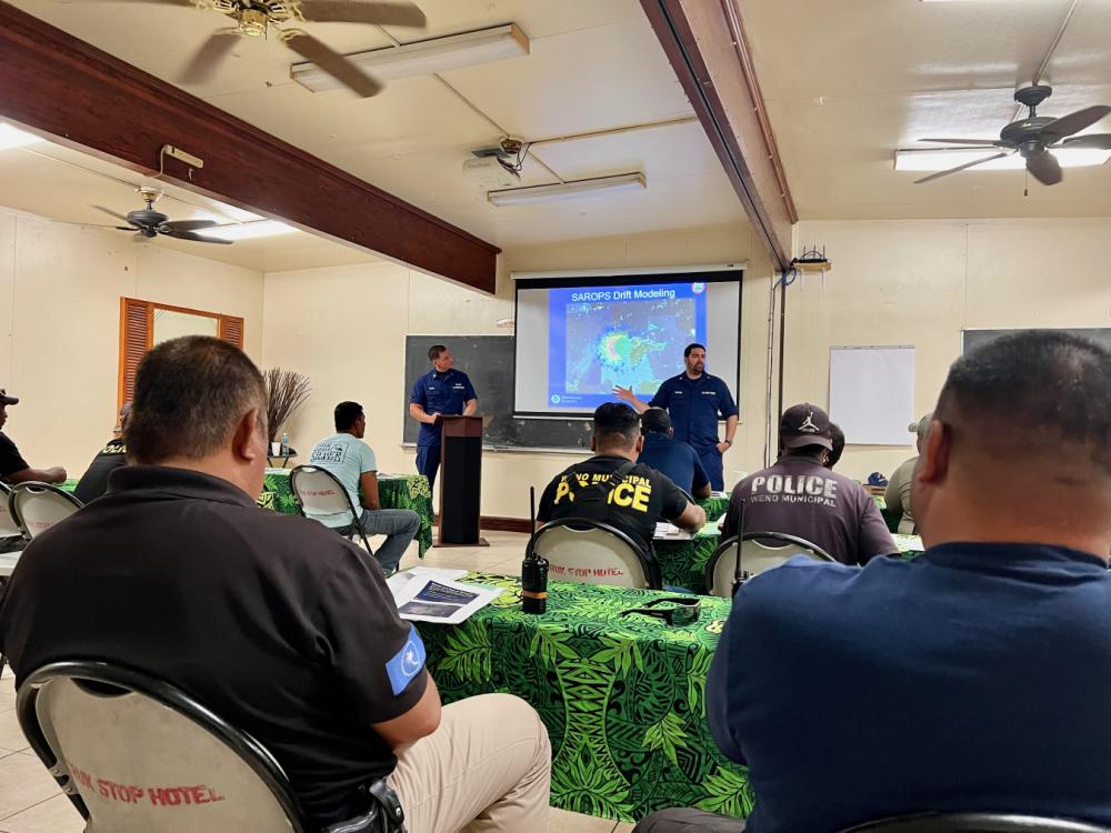.S. Coast Guard Forces Micronesia/Sector Guam members discuss planning during a search and rescue exercise in Weno, Chuuk, the Federated States of Micronesia, from Feb. 20, 2023. 