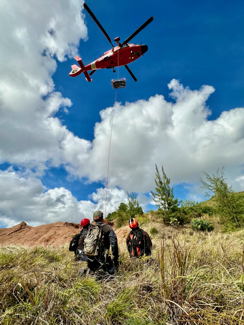 Guam Fire Department and U.S. Coast Guard members conduct rescue hoist training at Sella Bay Overlook in Guam on March 8, 2023. 